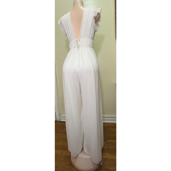 White jumpsuit with ruffles and wide legs - Picture 4 of 14